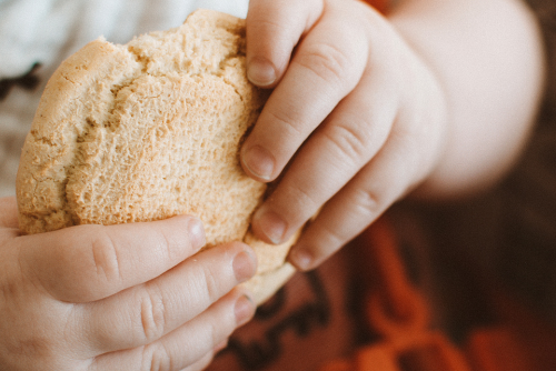 A toddler holding a toddler snack